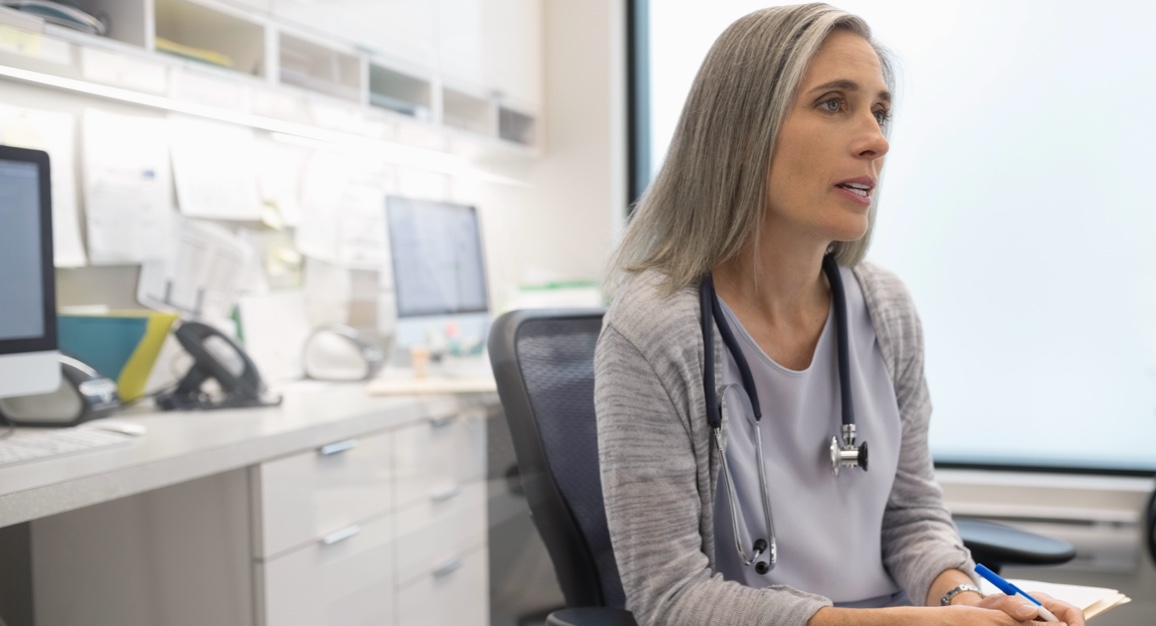 A healthcare provider sitting in her office and speaking about hepatitis C.